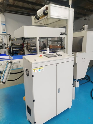 Straight-line heat-shrink packaging machine